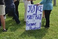 Ã¢â¬ÅJustice for Ashley Babbit and Roseanne Boyland,Ã¢â¬Â Sign Held by a Female Protester at the Justice for J6 Protest